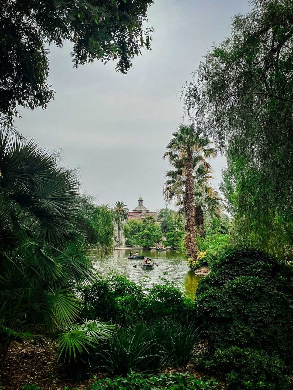 Parc de la Ciutadella in Barcelona, greenery and the lake among the trees