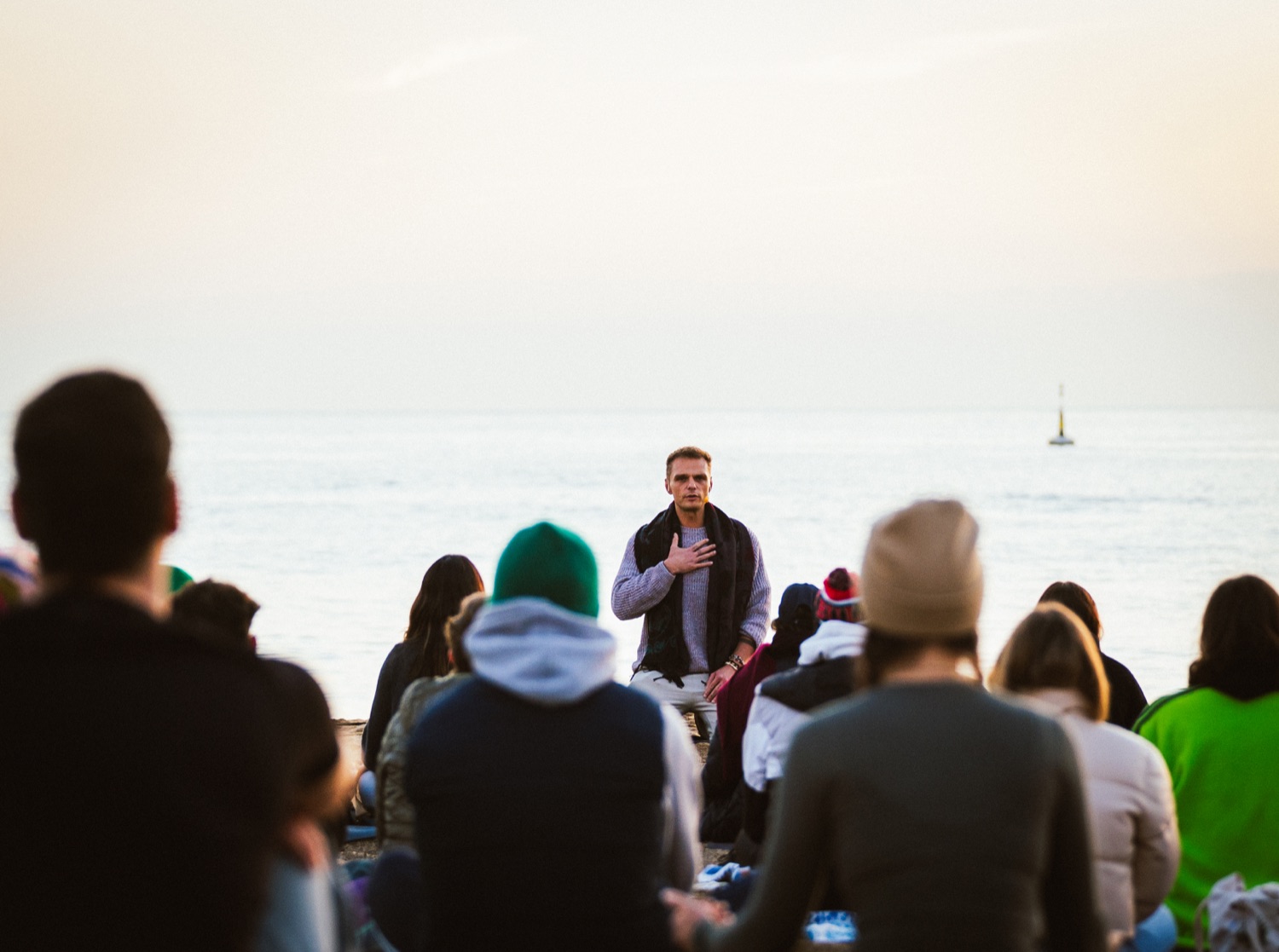 Piotr guiding a sunrise breath session by the sea
