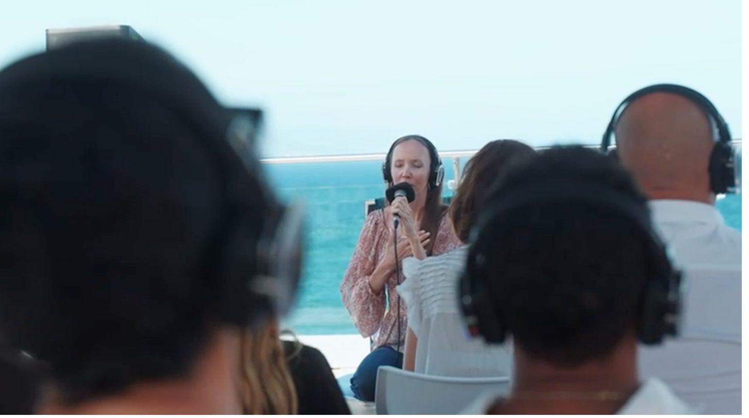 Yulia singing during a guided experience